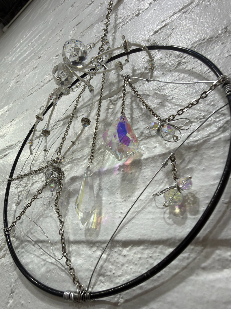 8 inch black circle with clear spider