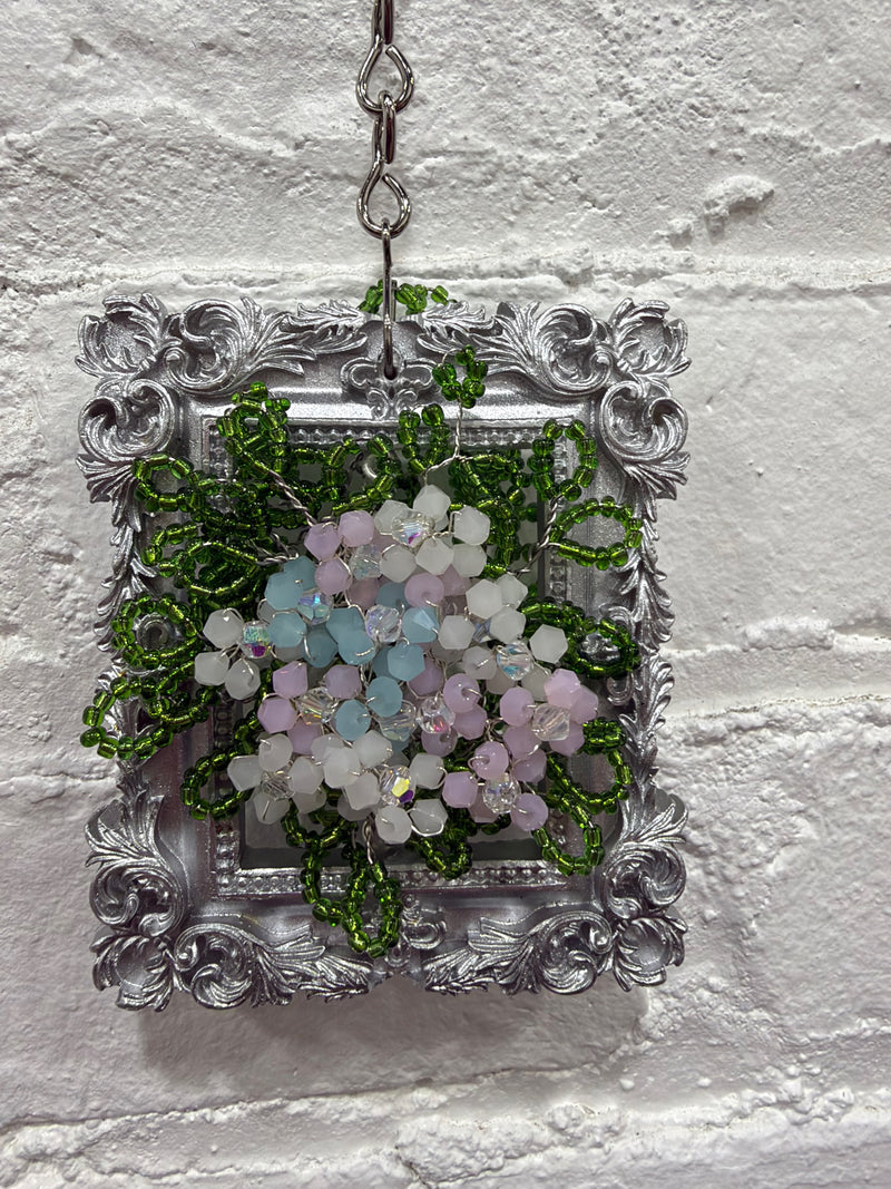 silver frame with pastel flowers & eucalyptus