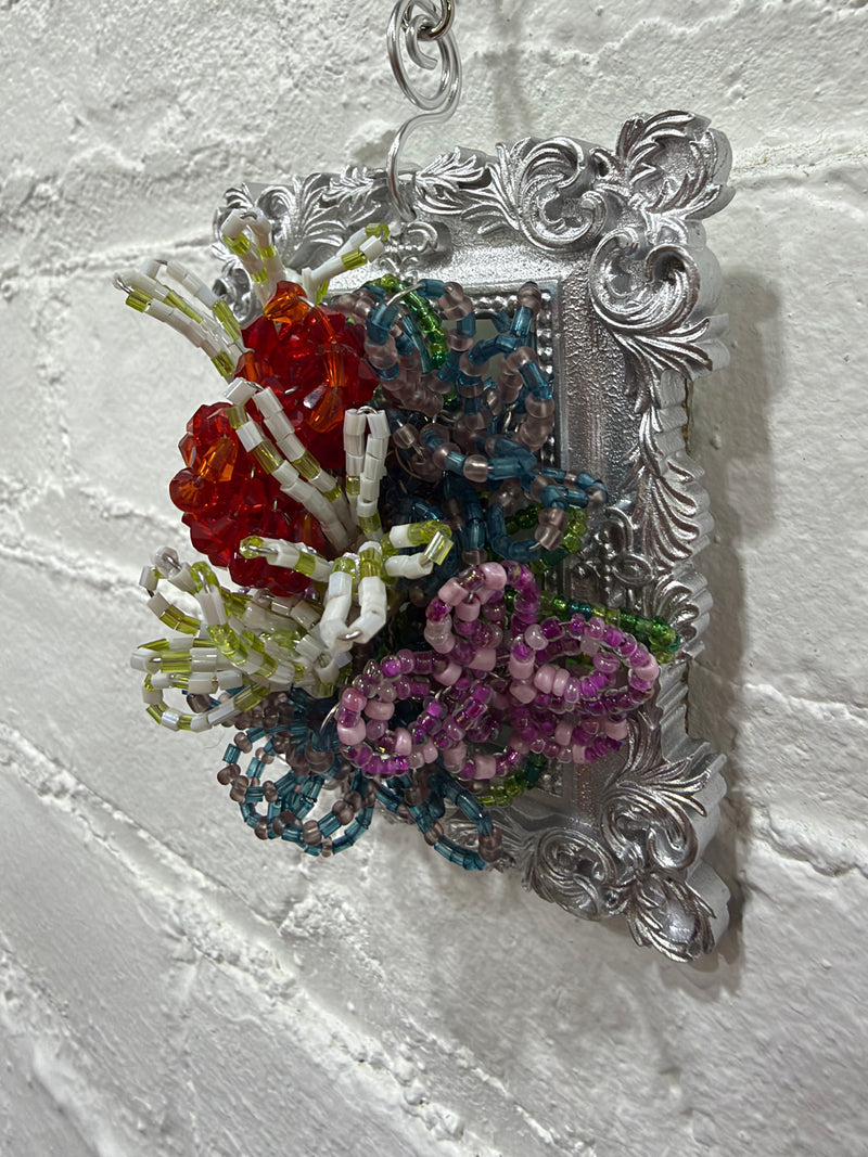silver square frame with mixed wild flowers