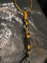 large copper and black wand