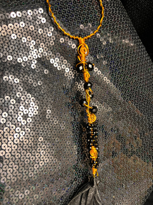 large copper and black wand