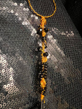 large copper and black wand