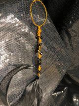 large copper and black wand