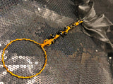 large copper and black wand