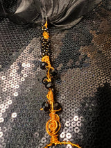 large copper and black wand