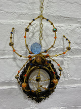 Black oval frame with gold Knicks Spider