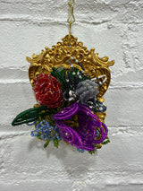 gold frame with large mixed flowers
