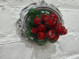 silver oval with a dozen roses
