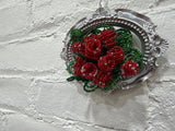 silver oval with a dozen roses