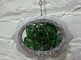 silver oval with a dozen roses