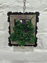 black square with purple and white flowers