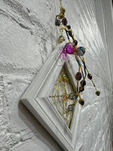 white square with purple spider