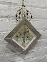 white square with purple spider