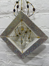 white square with purple spider