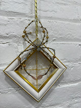 antique gold and white frame with blue spider