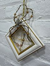 antique gold and white frame with blue spider