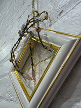 antique gold and white frame with blue spider