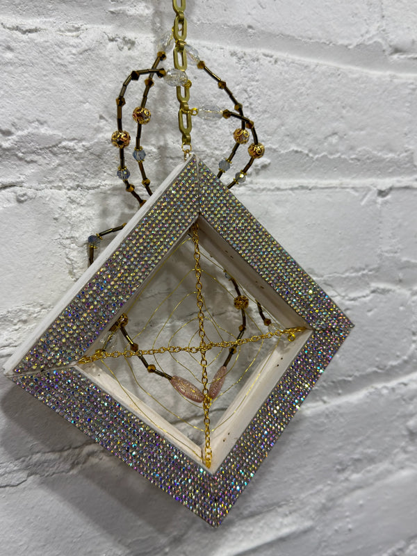 antique gold and white frame with blue spider
