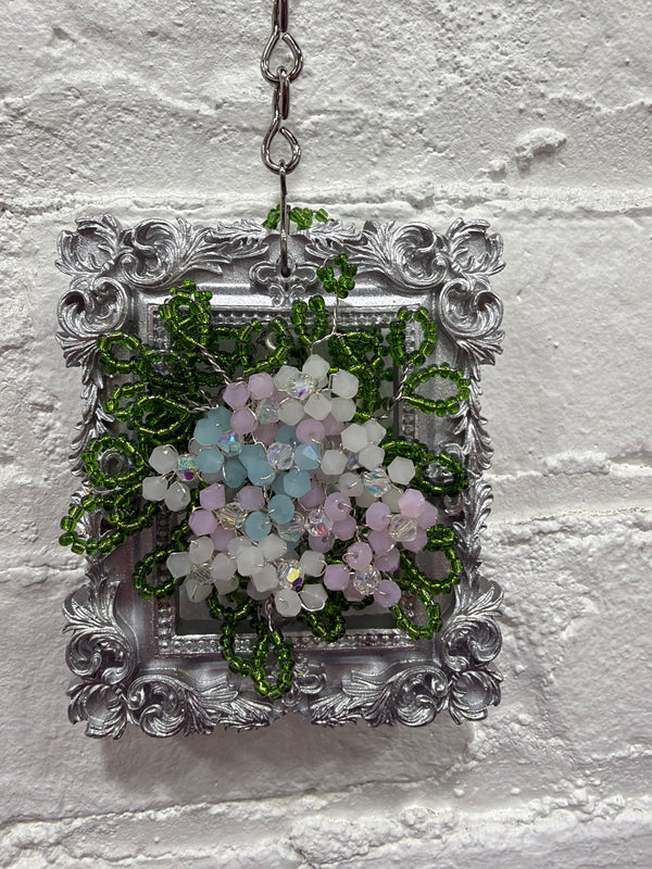 silver frame with pastel flowers & eucalyptus